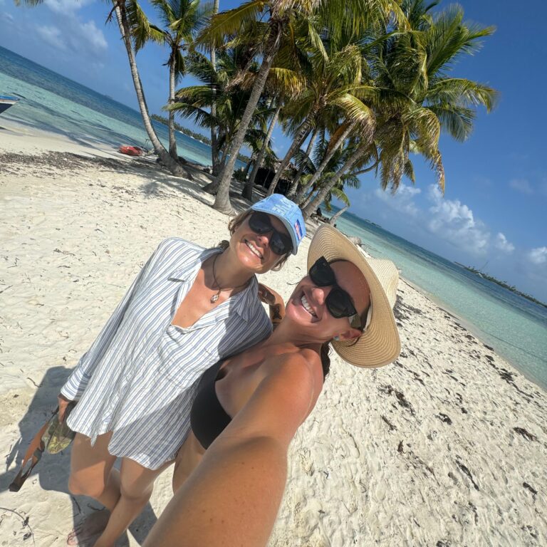 Two women taking a beach selfie during catamaran vacation in Panama