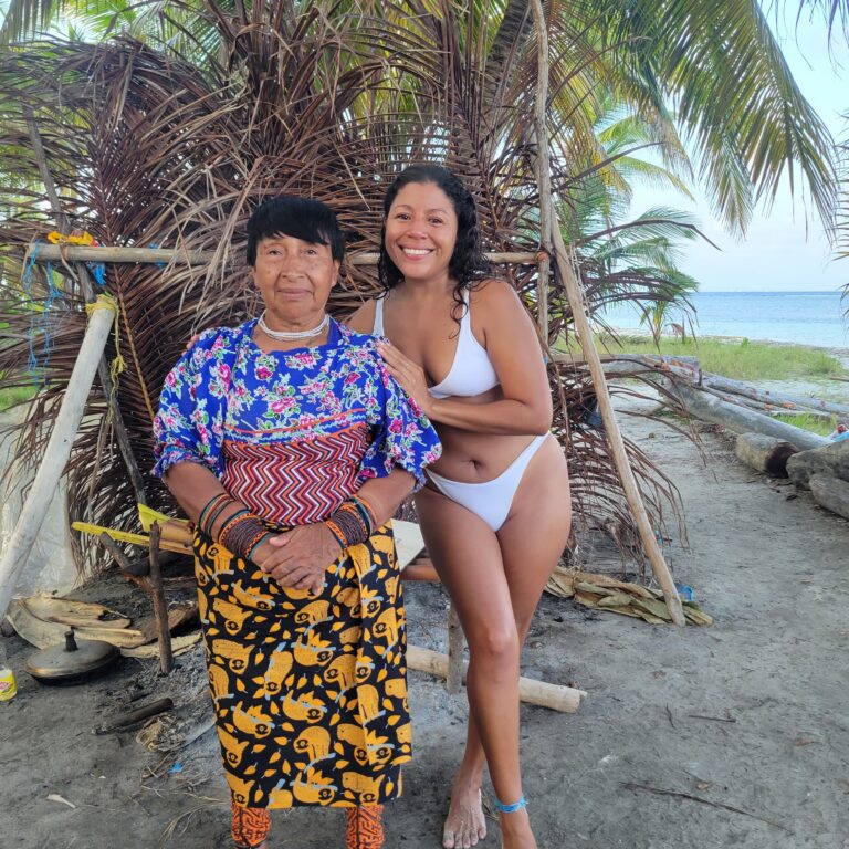a tourist girl hugging an indigenous women