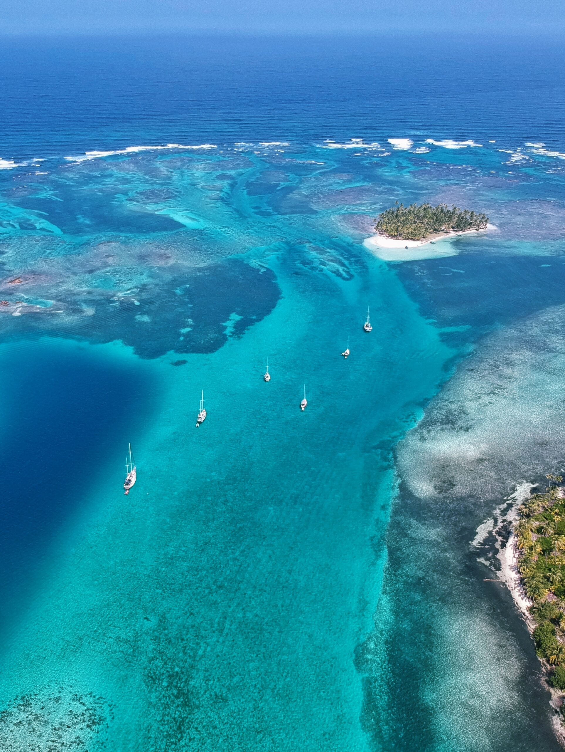 Catamaran anchored in the turquoise lagoon of San Blas, Panama