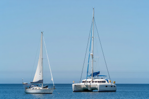 Two sailing boats anchored side by side in the Caribbean Sea near San Blas